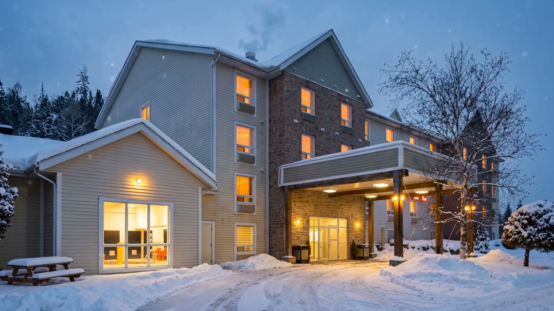 Hotel Terra under the snow at dusk, 20 minutes from Mont-Tremblant